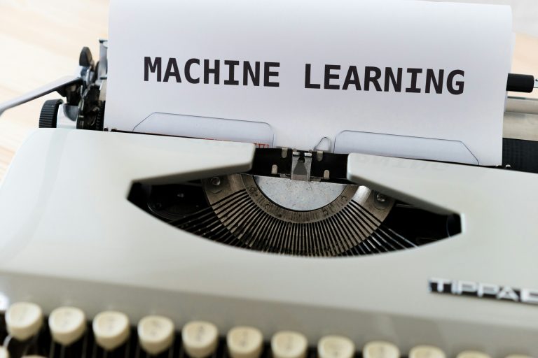 Machine learning concept on a typewriter, symbolizing AI-powered automation, predictive analytics, and data-driven decision-making.